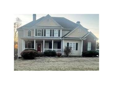 Charming two-story home with a welcoming front porch and well-maintained landscaping at 2532 Greenes Ln, Powder Springs, GA 30127