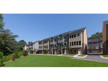 View of new townhomes featuring stone accents and neutral color palettes on a sunny day at 3794 Jack Vernon Cir, Powder Springs, GA 30127