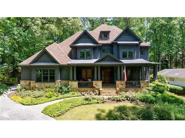 Charming two-story home with manicured front yard and inviting front porch at 3117 W Roxboro Ne Rd, Atlanta, GA 30324