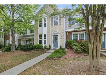 Charming townhome with landscaped front yard and inviting entryway at 3754 Berkeley Xing, Duluth, GA 30096