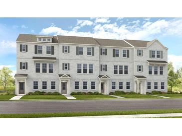 Charming townhome exterior with gray brick, shutters, and well-manicured lawn at 208 Maycrest Path, Tucker, GA 30084