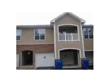 Charming townhouse with a covered parking space and a small balcony, a delightful place to call home at 3500 Sweetwater Rd # 522, Duluth, GA 30096