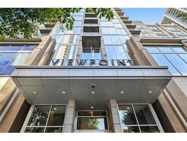 Contemporary building entrance features a modern design and prominent signage at 855 Peachtree Ne St # 1311, Atlanta, GA 30308