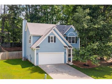 Charming two-story home with a well-manicured lawn and a classic suburban appeal at 1065 Dalby Way, Austell, GA 30106