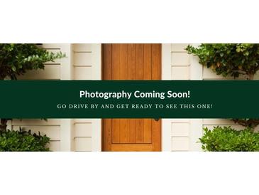 Charming front door of a house with 'Photography Coming Soon' banner and green shrubbery in a well-maintained garden at 180 Old Airport Rd, Carrollton, GA 30116