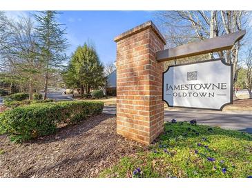 Welcome to Jamestown Oldtown: A charming community with a welcoming entrance and beautiful landscaping at 2300 Newport Lndg, Atlanta, GA 30009