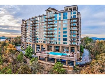 Upscale condo building featuring a rooftop pool and stunning city views at 2950 Mount Wilkinson Se Pkwy # 505, Atlanta, GA 30339