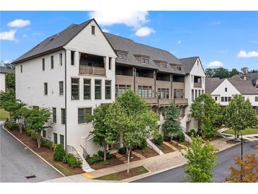 Stylish townhomes showcase attractive facades, professional landscaping, and inviting streetscapes at 6763 Encore Blvd, Atlanta, GA 30328