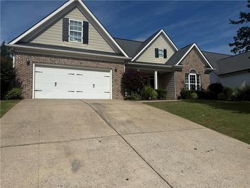 Charming one-story home with a two-car garage, brick accents, and a well-maintained lawn at 21 Spring Folly Nw, Cartersville, GA 30121