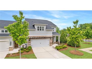 Charming two-story home with a manicured lawn and a welcoming entrance, perfect for suburban living at 4591 Grenadine Cir, Acworth, GA 30101