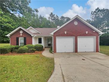 Charming brick home with a well-maintained front yard and a two-car garage at 3146 Leyland Ct, Decatur, GA 30034