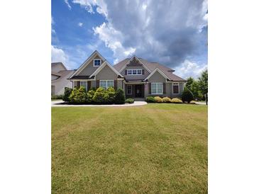 Charming two-story home with well-manicured lawn and beautiful landscaping at 312 Archway Ln, Peachtree City, GA 30269