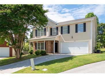 Charming two-story home with a stone-accented porch and a well-maintained front lawn at 45 Waterloo Ct, Hiram, GA 30141