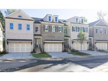 Charming townhomes feature multi-car garages and eye-catching architectural details at 2260 Siskin Square Rd # 90, Duluth, GA 30096