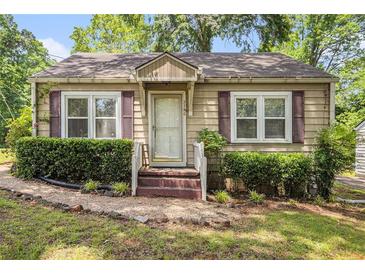 Charming single-story home featuring a cozy front porch and well-maintained landscaping at 3146 Alston Dr, Decatur, GA 30032