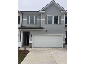 Charming two-story home featuring a spacious two-car garage and gray color scheme at 6423 Rosetta Drive, Unit 66 # 66, South Fulton, GA 30331