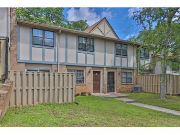 Charming townhouse with a cozy front yard and a classic brick facade, offering a welcoming curb appeal at 1150 Rankin St # 19O, Stone Mountain, GA 30083