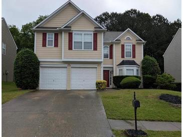 Charming two-story home with red shutters, a two-car garage, and a well-maintained lawn at 3514 Ethridge Nw Ln, Kennesaw, GA 30144