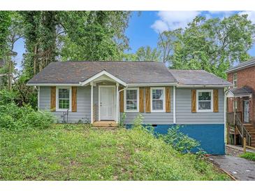 Charming single-story home featuring rustic shutters and a covered entryway at 1285 North Nw Ave, Atlanta, GA 30318
