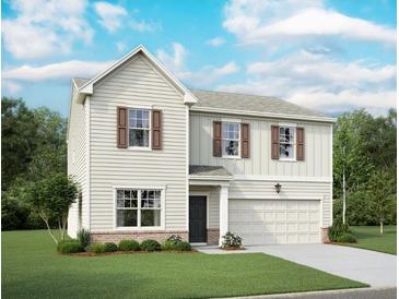 Charming two-story home with neutral siding, dark shutters, and a well-manicured front lawn at 7775 Sudbury Cir, Covington, GA 30014