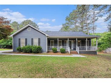 Charming single-story home with a welcoming front porch and well-maintained landscaping at 325 N Oakland Cir, Mcdonough, GA 30253