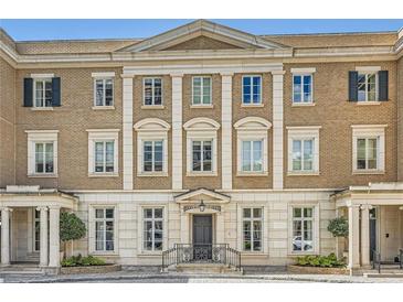 Elegant multi-story townhome with detailed architectural features and manicured landscaping at 2440 Peachtree Nw Rd # 9, Atlanta, GA 30305