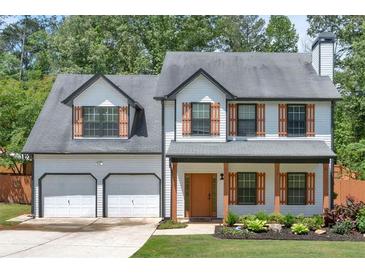 Charming two-story home with a two-car garage and inviting front porch at 40 Polo Xing, Hiram, GA 30141