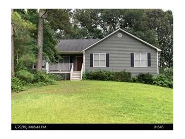 Charming single-story home with gray siding, black shutters, and a well-manicured front lawn at 251 Lambeth Dr, Hiram, GA 30141
