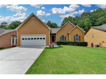 Charming single-Gathering home with a well-manicured lawn and a two-car garage in a serene neighborhood at 2694 Sterling Dr, Lawrenceville, GA 30043