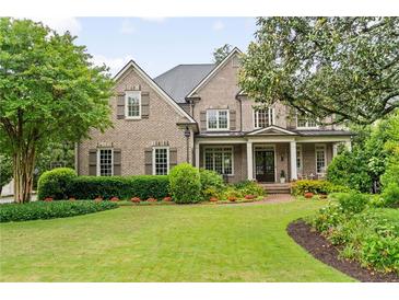 Charming brick home with a manicured lawn and inviting front porch at 2870 Redding Ne Rd, Atlanta, GA 30319