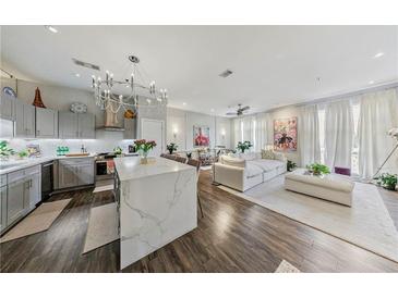 Bright and airy living room featuring a modern kitchen and elegant decor, creating a welcoming atmosphere at 560 Dutch Valley Ne Rd # 2207, Atlanta, GA 30324
