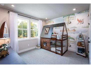 Fun bedroom featuring a log cabin style bunk bed and decorative camping themed wall art at 129 Henley St, Canton, GA 30114