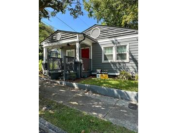 Charming bungalow-style home with a welcoming front porch and well-maintained landscaping at 1081 Ashby Grv, Atlanta, GA 30314