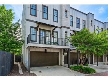 Charming three-story townhome featuring a private balcony and a convenient one-car garage at 743 Taylor Ne Ct, Atlanta, GA 30324