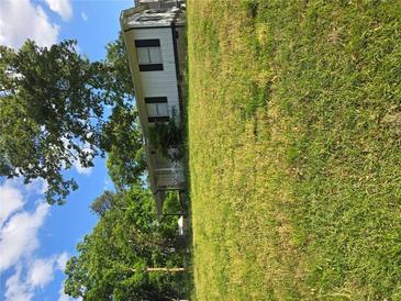 Modest one-story home featuring a grassy yard, offering a peaceful, suburban living experience at 6136 Holiday Blvd, Forest Park, GA 30297