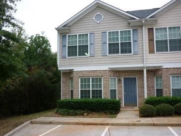 Two-story townhome with brick facade and light-blue shutters at 2502 Walden Lake Dr, Decatur, GA 30035