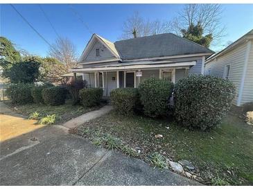 Quaint single-story home with a traditional design and landscaped front yard at 158 Milton Sw Ave, Atlanta, GA 30314
