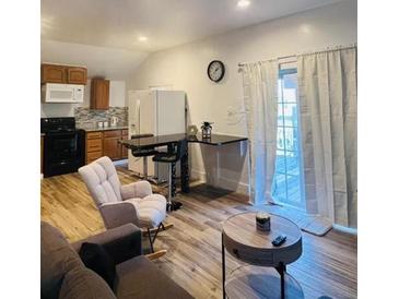 Open concept living area with modern finishes and plenty of natural light at 2021 Moody Drive Southwest, Atlanta, GA 30315