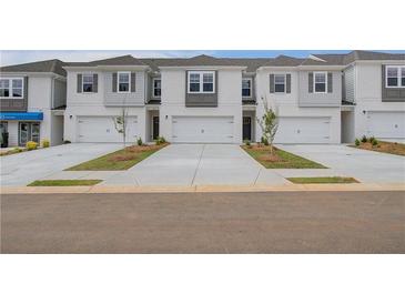 Newly constructed townhomes feature eye-catching designs and attached garages at 305 Heavenly Hollow Pl, Mcdonough, GA 30253