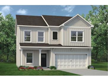 Charming two-story home with a well-manicured lawn and inviting front porch at 379 Morgan Rd, Carrollton, GA 30116