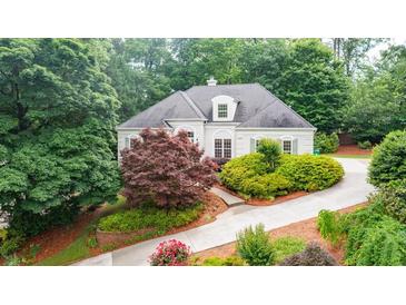 Charming home with a well-manicured front yard, colorful landscaping, and a private driveway at 2695 Rangewood Ne Dr, Atlanta, GA 30345