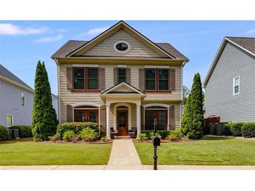 Charming two-story home featuring a well-manicured lawn and craftsman-style architectural details at 4619 Sweetwater Ave, Powder Springs, GA 30127