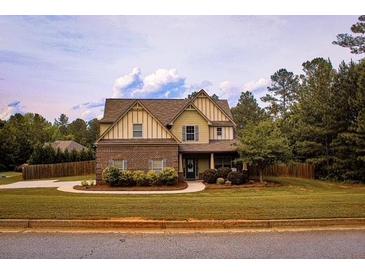 Charming two-story home with manicured lawn and welcoming front entrance at 237 Arborview Dr, Mcdonough, GA 30252