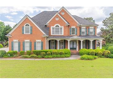 Stately brick home with a manicured lawn and charming curb appeal at 1900 Briergate Dr, Duluth, GA 30097