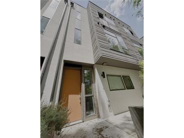 Modern townhouse showcasing sleek architectural design and neutral color palette at 1153 Reynolds Square Ln # 16, Atlanta, GA 30307