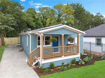 Charming bungalow with inviting front porch and meticulously landscaped front yard offers great curb appeal at 75 Mayson Ne Ave, Atlanta, GA 30307