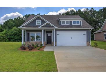 Charming home featuring a two-car garage and welcoming front porch at 109 Sunflower Ne Cir, Cartersville, GA 30121