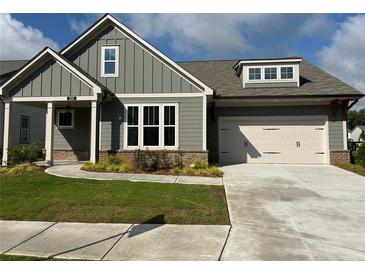 Charming single-Gathering home with a well-maintained lawn, two-car garage and inviting curb appeal at 208 Saratoga Dr, Acworth, GA 30102
