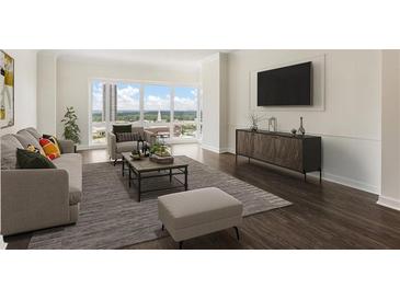 Bright living room features large windows with scenic views and contemporary decor at 3475 Oak Valley Rd # 1850, Atlanta, GA 30326