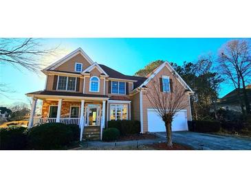 Beautiful two-story home with stone accents, a two-car garage, and manicured landscaping at 190 Country Club Dr, Hiram, GA 30141